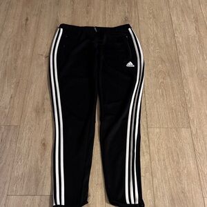 Adidas Black Track Pants with zipper bottom. Size M